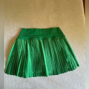 Green pleated skirt